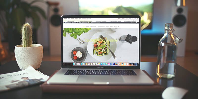 Sample culinary website on laptop.
