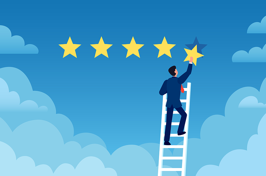 Cartoon drawing of businessman climbing a ladder carrying the fifth star of a five start review.