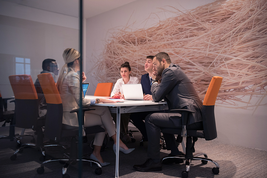 Group of business people having a meeting in a modern agency office. 